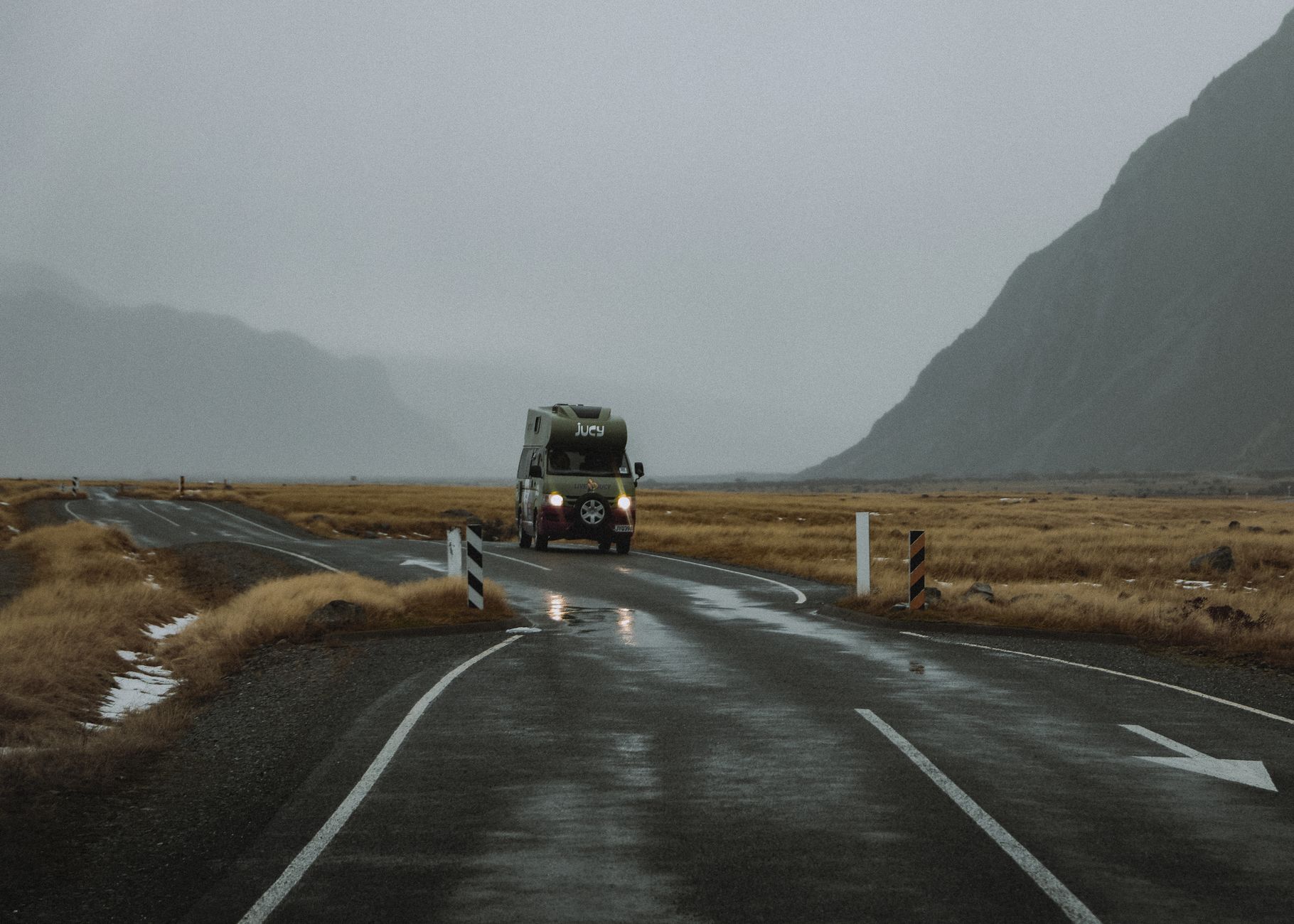 Campervan driving across Haast pass river bridge