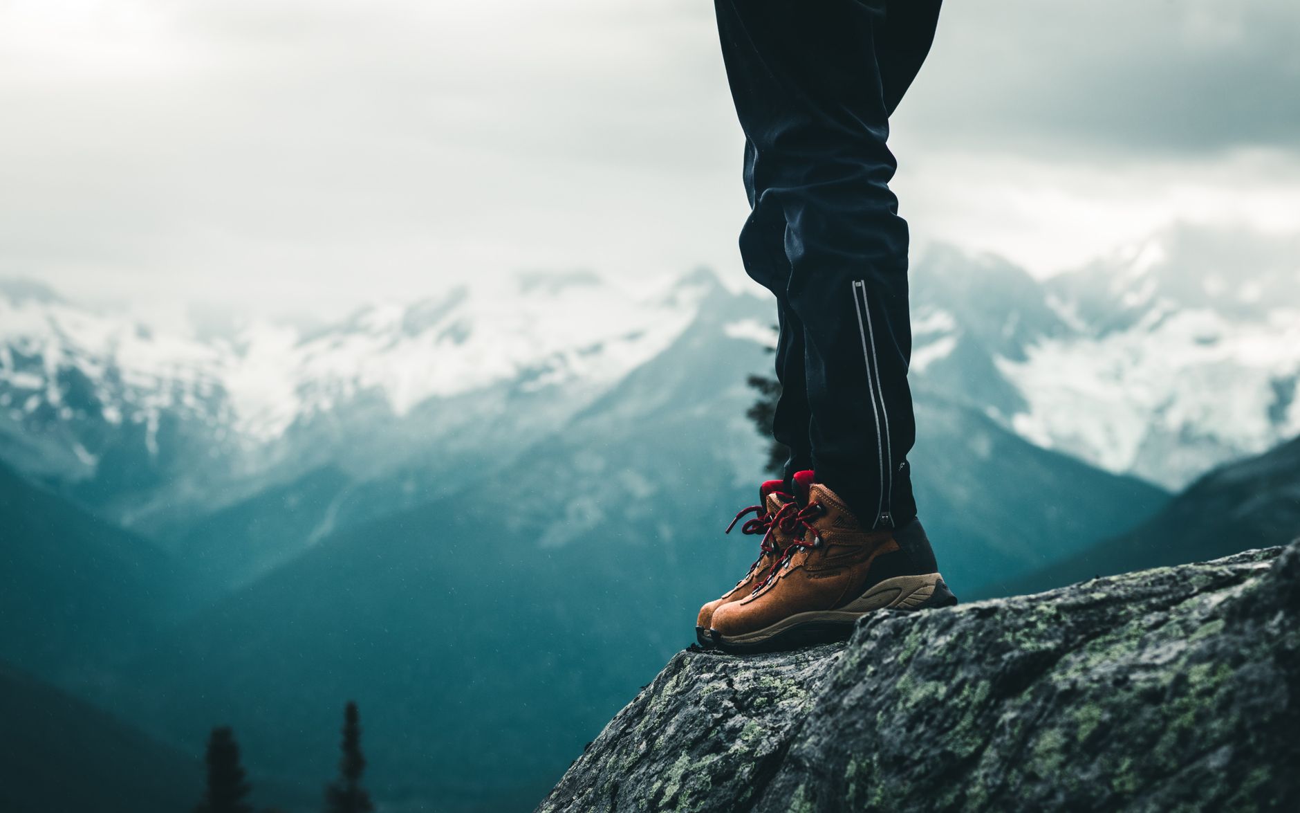 Trekking poles and topographic map on granite rock